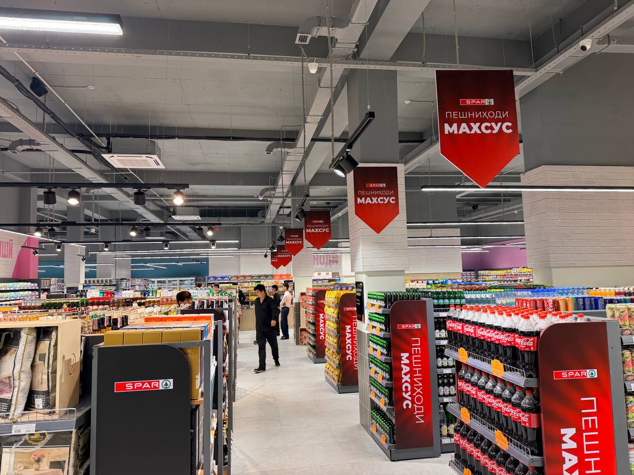 Aisles of the SPAR supermarket in Dushanbe with SPAR-branded promotion displays